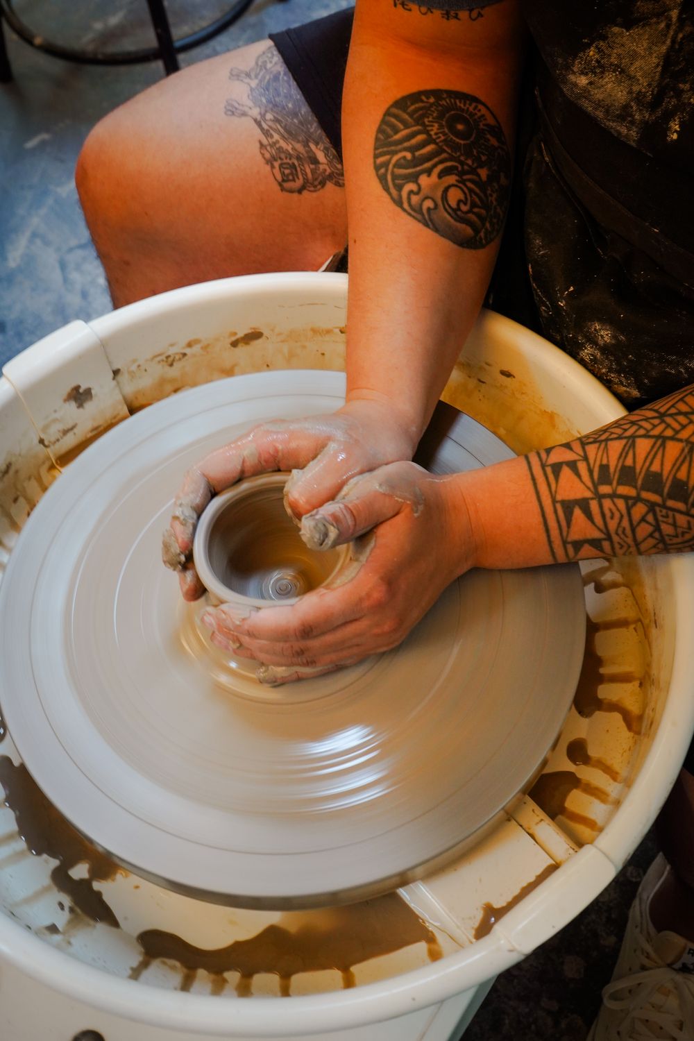 Centering fresh clay on the wheel head